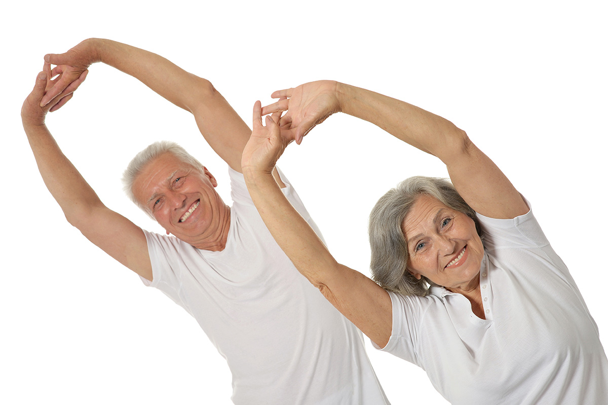 Portrait of Senior Couple Exercising On White Background